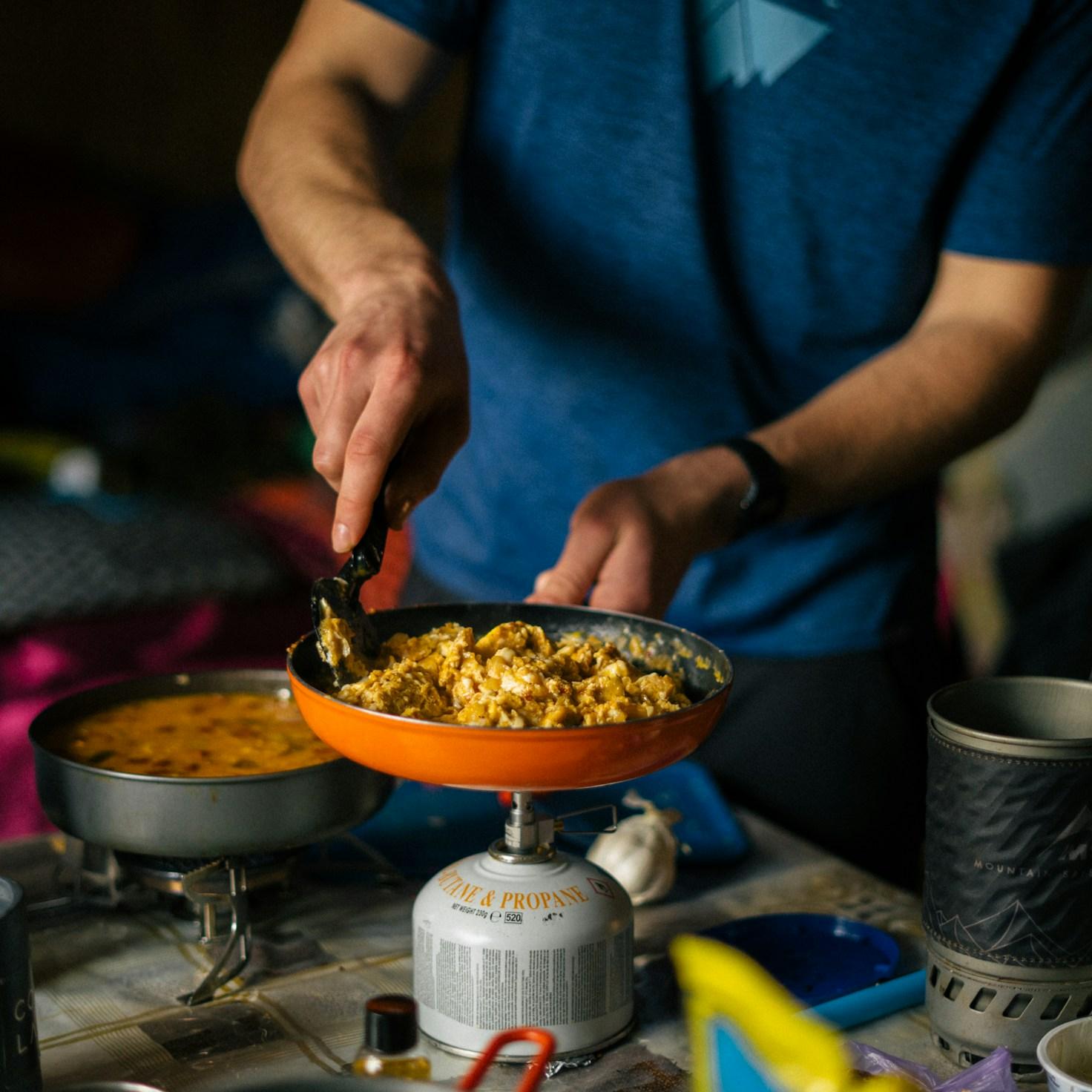 Community members collaborating in a modern kitchen space, sharing recipes and cooking techniques